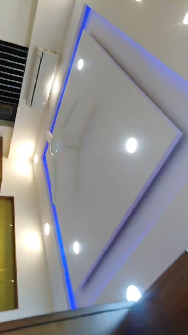 Diamond-shaped false ceiling design with blue LED cove accent lighting